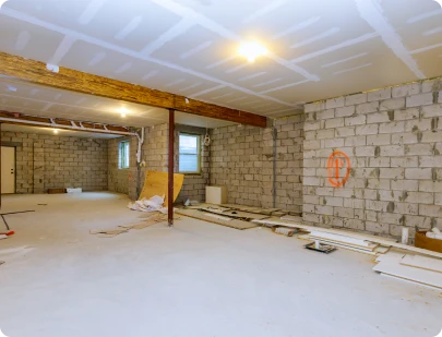 Finished basement with exposed wood beam ceiling