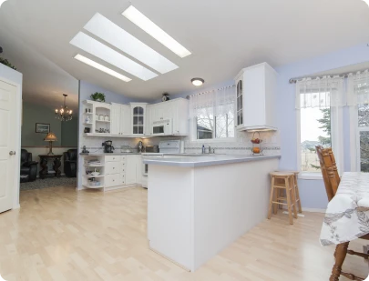 Bright custom-renovated kitchen with skylights and center island