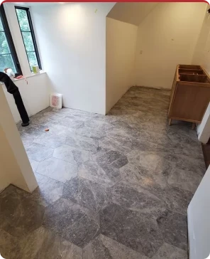 Renovated loft space with tile flooring and large window
